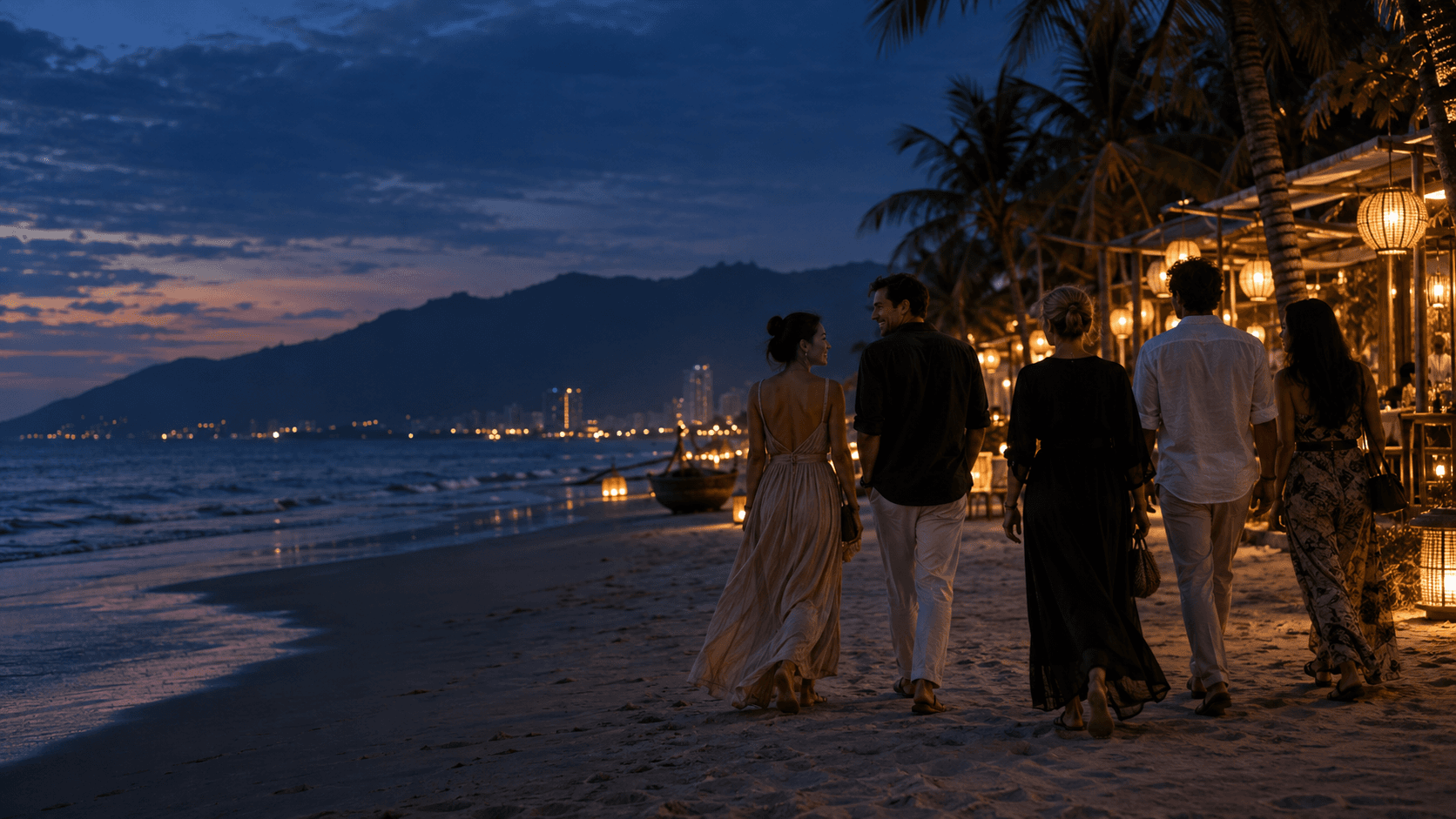 Guests walking along the Da Nang coast at dusk