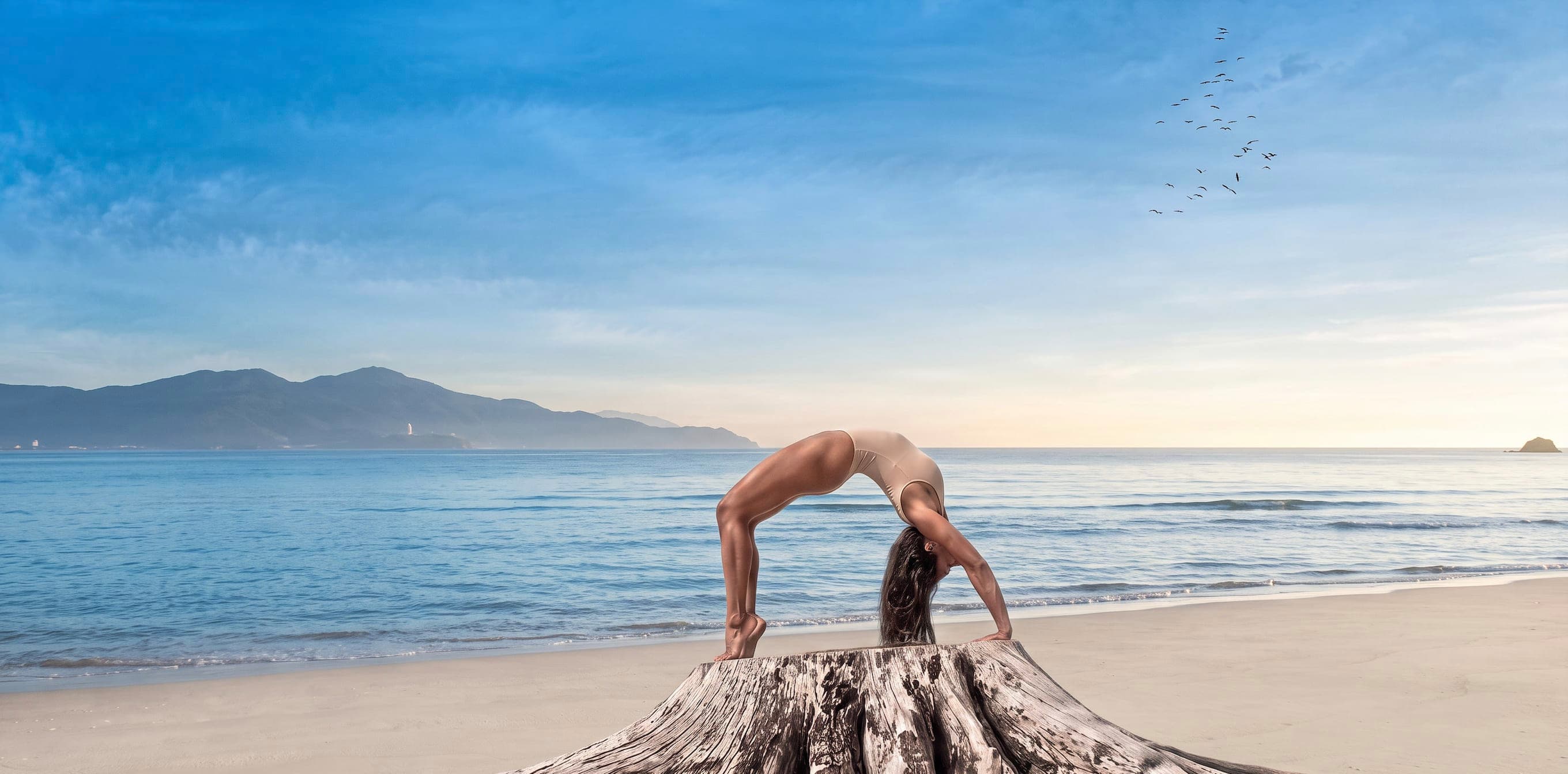 Yoga wheel practice overlooking the sea in Da Nang